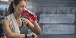woman reading notifications at the gym