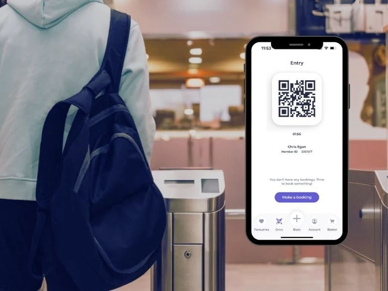 Man at gates with bag and QR code from Go App