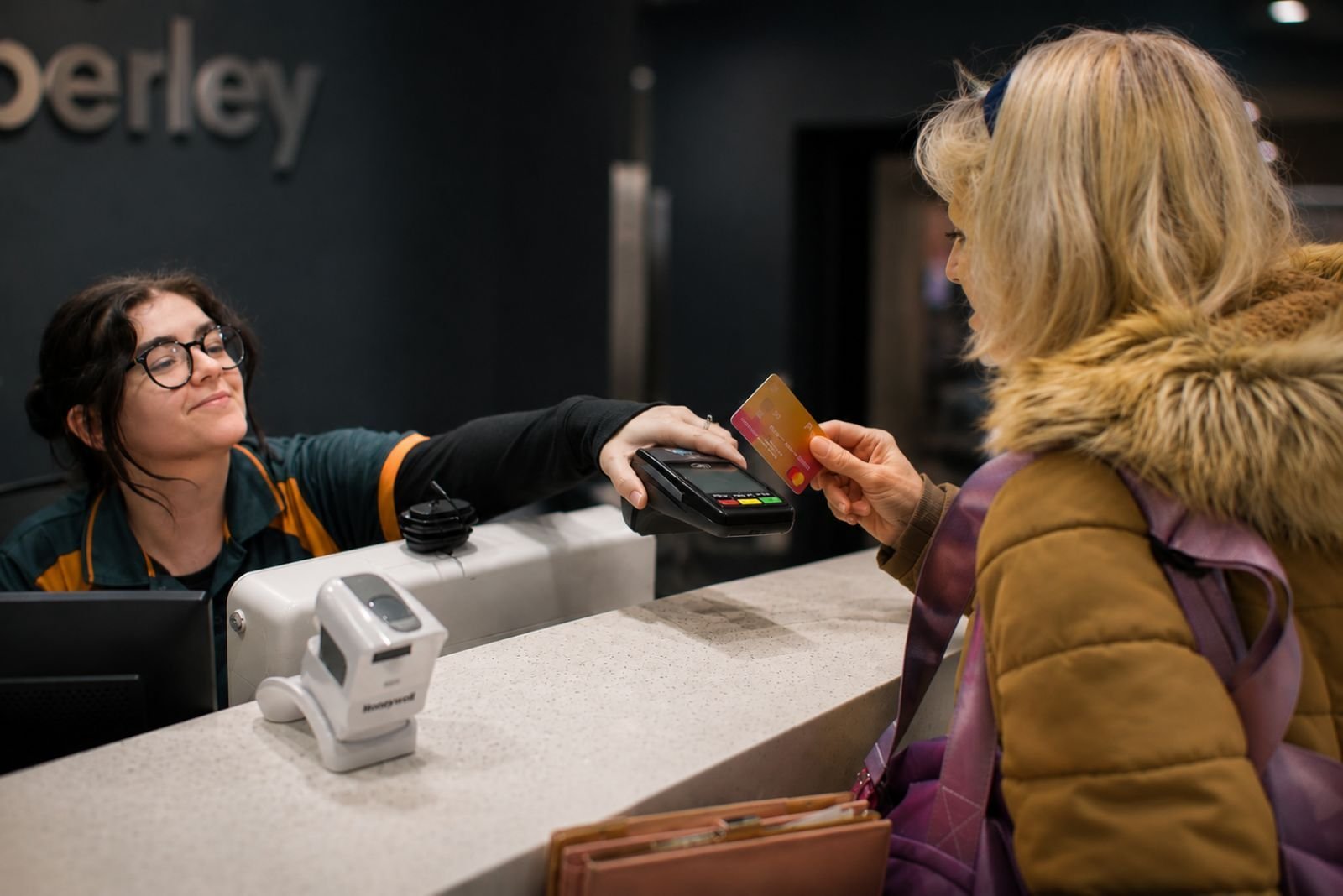 Place Leisure customer making a payment at the reception desk - gladstone case study